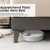 A robot vacuum cleaner is shown under a bed, illustrating the space available for storage and cleaning. Náhled obrázku produktu