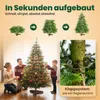 A family decorating a Christmas tree indoors, with a close-up of the tree's stand mechanism. Produktbild-Vorschau