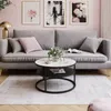 A living room scene with a sofa, coffee table, and artwork. Produktbild-Vorschau