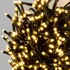 A close-up view of a tangled cluster of warm white LED lights on black wires. Náhled obrázku produktu
