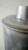 Close-up of a metal cylinder with a pipe attached to the top. Produktbild-Vorschau