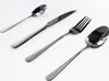 A set of four stainless steel cutlery items arranged diagonally on a white background. Produktbild-Vorschau