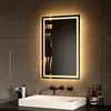 A modern bathroom sink with a lit mirror above it. Produktbild-Vorschau