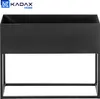 A black metal planter stand with a rectangular planter box on top, shown against a white background. Produktbild-Vorschau