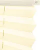 A close-up view of a cream-colored pleated blind, showing the texture and folds. Produktbild-Vorschau
