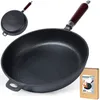 A cast iron frying pan with a wooden handle is shown, along with its packaging. Produktbild-Vorschau