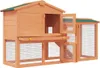 A wooden rabbit hutch with multiple levels and enclosed areas. Náhled obrázku produktu