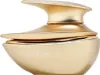 A gold-colored perfume bottle with a unique, sculptural design. Voir les images du produit