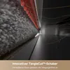 Close-up, abstract view of a cleaning mechanism, possibly a vacuum cleaner head, with hair being processed. Produktbild-Vorschau