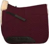 A close-up, studio shot of a burgundy horse saddle pad with cream-colored sheepskin trim and a black leather wear patch. Produktbild-Vorschau