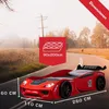 A red race car-shaped bed is shown on a road with a scenic background. Produktbild-Vorschau
