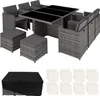 A rattan dining set with chairs and ottomans, with a black cover and white squares shown below. Voir les images du produit