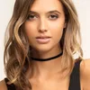 Close-up portrait of a young woman wearing a black choker necklace. Náhľad obrázku produktu