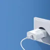 A white USB charger plugged into a white wall socket against a blue background. Náhled obrázku produktu