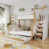 A children's bedroom with a bunk bed, trundle bed, and stairs with drawers. Anteprima dell’immagine prodotto