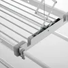 A close-up view of the mechanism and frame of a wall-mounted clothes drying rack. Produktbild-Vorschau
