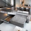 A modern living room with a large sectional sofa, dining table, and kitchen island. Produktbild-Vorschau