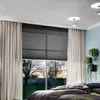 A bedroom scene with a large window showing trees and a sunset, with curtains and blinds. Produktbild-Vorschau