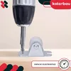 A close-up of a drill being used to screw a small roller onto a wooden surface, with marketing text and logos. Anteprima dell’immagine prodotto