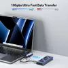 A USB hub connected to a laptop, with an external drive connected to the hub. Produktbild-Vorschau