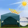 A teal pop-up gazebo is set up on a grassy lawn under a bright sunny sky. Arrows indicate UV rays being blocked by the gazebo. Produktbild-Vorschau