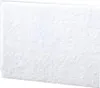A close-up, textured view of a white filter or pad. Náhled obrázku produktu