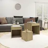 A living room scene with a sofa, coffee table, and decorative items. Náhled obrázku produktu