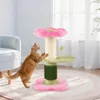 A cat is playing with a pink and green cat tree in a living room. Produktbild-Vorschau