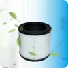 A close-up studio shot of an air purifier filter with green leaves seemingly blowing around it. Náhled obrázku produktu