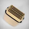 A close-up, top-down view of the foil head of a gold electric shaver. Anteprima dell’immagine prodotto