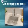 A modern kitchen sink with a faucet, set against a blurred background with text. Produktbild-Vorschau