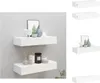 Two white floating shelves mounted on a light gray wall, decorated with various items. Produktbild-Vorschau