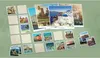 A collection of travel-themed postcards and blank cards arranged on a green surface. Produktbild-Vorschau