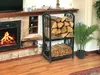 A fireplace with a wood rack filled with firewood next to it, and a plant in a pot. Produktbild-Vorschau
