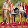 Four people are gathered around an electric grill in a backyard setting, enjoying a barbecue. Produktbild-Vorschau