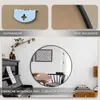 Collage showing a round mirror with a black frame, a close-up of the mirror's backing, and a close-up of a hanging mechanism. Produktbild-Vorschau