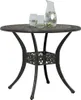 A bronze-colored round garden table with a decorative base, set against a white background. Two glasses and a pitcher of water with lime slices are on the table. Náhľad obrázku produktu