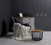 A cozy living room corner with a chair, side table, and dresser. Náhled obrázku produktu