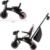 Two views of a pink and black Kinderkraft Jazz 2 foldable trike-trike, with dimensions indicated. Voir les images du produit