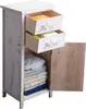 A white wooden cabinet with two open drawers and one open door, revealing folded linens inside. Náhľad obrázku produktu