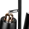 A close-up view of a black and gold lamp, focusing on the adjustable joint and shade. Náhled obrázku produktu