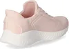 A side view of a pink Skechers sneaker with a white sole. Voir les images du produit