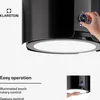 A close-up view of a black kitchen hood with a hand adjusting a control knob. Náhľad obrázku produktu
