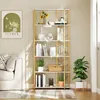 A modern, multi-shelf bookcase with decorative items and plants, placed in a living room setting next to a sofa. Produktbild-Vorschau