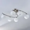 A ceiling light fixture with six frosted glass globes attached to a curved metal frame, mounted on a white ceiling. Produktbild-Vorschau