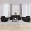 A living room scene with a black velvet sofa set and a coffee table.