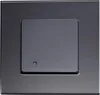 A close-up studio shot of a dark gray motion detector. Produktbild-Vorschau