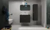 A modern bathroom with a vanity, sink, mirror, and storage cabinet. Voir les images du produit