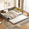 A bedroom scene with a daybed pulled out, showing a trundle bed underneath. The room is decorated with artwork and a rug. Anteprima dell’immagine prodotto