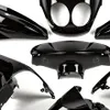 A collection of black motorcycle fairing parts arranged against a white background. Podgląd zdjęcia produktu